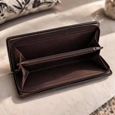 Brown quilted zip around wallet with structured metal frame edges