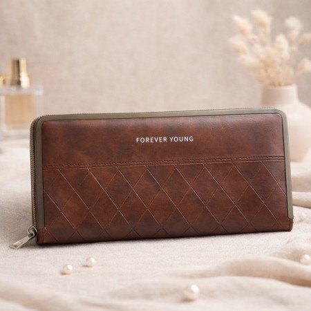 Brown quilted zip around wallet with structured metal frame edges