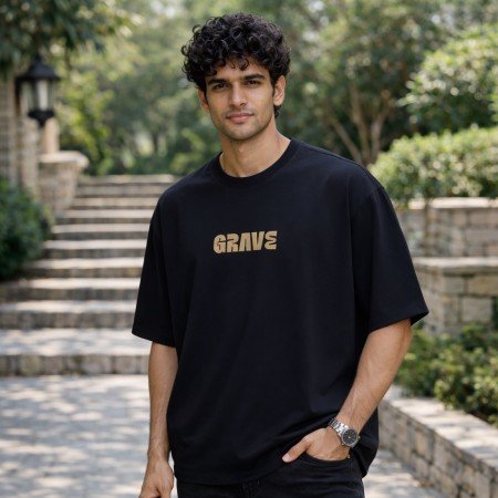Men black oversized crew neck graphic t-shirt with text print on chest, front view