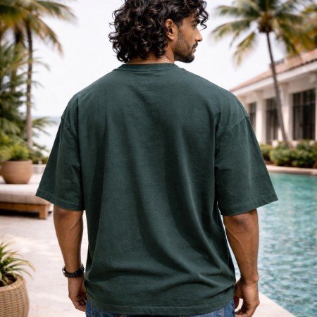 Men washed dark green oversized crew neck graphic t-shirt with varsity text print, front view