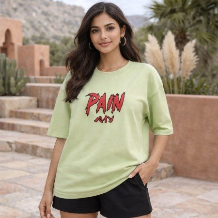 Female model wearing unisex sage green oversized cotton T-shirt featuring Naruto Pain anime graphic print on front.