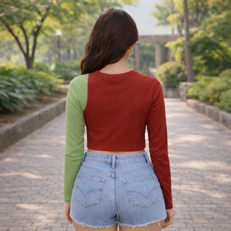 Women’s color block asymmetric full sleeve ribbed crop top in red and green, front view, free size fit