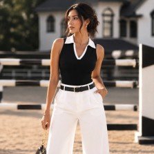 Black ribbed sleeveless polo knit top for women with contrast white collar front view