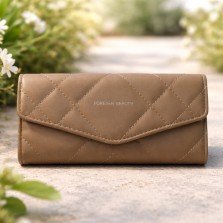 Front view of brown quilted flap wallet for women