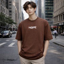 Men's brown oversized 100% cotton crew neck T-shirt with minimal chest text print and relaxed streetwear fit.