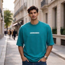 Men Mercedes blue oversized crew neck t-shirt with text print on front, front view