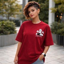 Front view oversized red Death Note anime T-shirt with Light Yagami design worn by female model relaxed fit