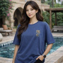 Female model wearing unisex blue oversized cotton T-shirt with Jujutsu Kaisen Yuji Itadori anime graphic.