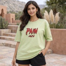 Female model wearing unisex sage green oversized cotton T-shirt featuring Naruto Pain anime graphic print on front.