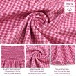 Close-up of soft 100% cotton berry pink gingham fabric with breathable lightweight finish.