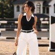 Black ribbed sleeveless polo knit top for women with contrast white collar front view