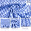 Close-up of breathable 100% cotton blue gingham fabric with soft texture, elastic smocking and peplum finish.