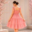 Back view of Blush Reverie pastel pink midi dress with ruffle shoulder straps and tiered silhouette