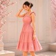 Side view of Blush Reverie midi dress featuring gathered waist and flowing tiers
