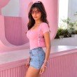 Side profile of a bubblegum pink sweetheart neckline bodysuit with body-hugging fit