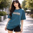 Female model wearing a teal blue Goku anime oversized t-shirt with minimalist front artwork and casual styling