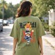 Female model displaying the back graphic of an olive green Dragon Ball Z t-shirt featuring Vegeta artwork.