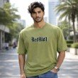 Male model wearing an olive green Dragon Ball Z oversized t-shirt featuring Vegeta-inspired front typography.