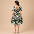Back view of women's green floral midi dress with tie-back detail and floral pattern