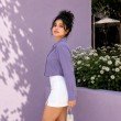 Side view of lilac cropped shirt featuring a collared neckline and cropped hem