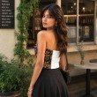 Back view of Midnight Botanica floral tube top featuring a comfortable smocked back