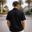 Back view of men cotton jersey polo T-shirt with solid black panel and relaxed short sleeve design.