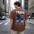 Back view of men's brown oversized cotton T-shirt with large street style graphic artwork and drop shoulder fit.