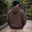 Back view of men brown oversized hoodie featuring relaxed fit, soft cotton fabric, and hooded design for casual streetwear.