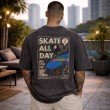 Men washed charcoal oversized crew neck graphic t-shirt with large skate artwork on back, back view