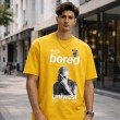 Men yellow oversized crew neck graphic t-shirt with printed front design, front view