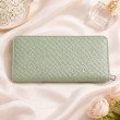 Back side of mint green zip around wallet for women in textured leather finish