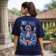 Female model displaying the back design of a navy blue One Piece oversized t-shirt featuring a bold Luffy character print