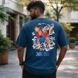 Male model displaying the back of a navy blue One Piece graphic t-shirt with a large Luffy character artwork and anime-inspired design