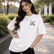 Female model wearing a white One Piece oversized anime t-shirt with a relaxed fit
