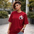 Front view oversized red Death Note anime T-shirt with Light Yagami design worn by female model relaxed fit