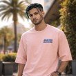 Front view men’s pink oversized anime T-shirt with Jujutsu Kaisen Gojo Satoru text print in casual streetwear style