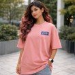 Unisex pink oversized T-shirt front view featuring Jujutsu Kaisen Gojo Satoru print, female model wearing relaxed fit