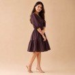 Side view of women's chocolate brown fit and flare midi dress with gathered skirt