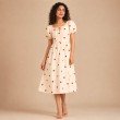 Women's cream midi dress with red heart print, puff sleeves and tie-neck detail