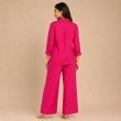 Back view of women's pink matching Mal cotton shirt and wide leg pants co-ord set
