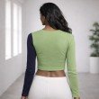 Women’s color block asymmetric full sleeve ribbed crop top in green and navy blue, back view, free size fit